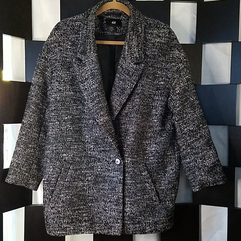 Black and White (tweed?) coat.